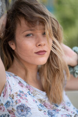 Natural Looking Young Beautiful Woman with Hazel eyes posing in abandoned building, no post editing