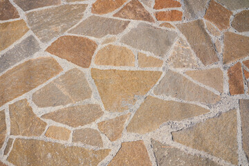 Orange old stone road surface. Seamless Texture. The texture of a stone road. High quality photo