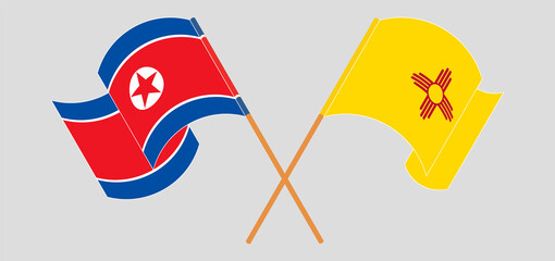 Crossed and waving flags of North Korea and the State of New Mexico