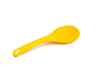 Yellow plastic rice spoon isolated on white background