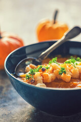 Pumpkin soup served with croutons