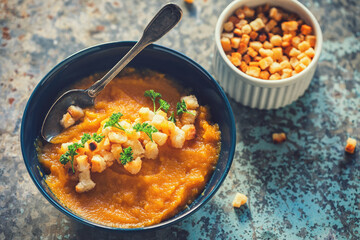 Pumpkin soup served with croutons