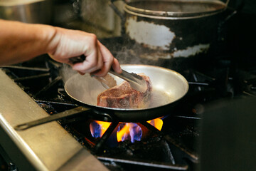 Chef cooking steak