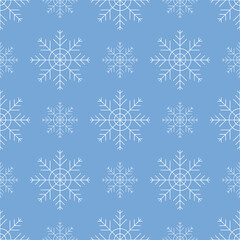 Fototapeta na wymiar Seamless winter background with white snowflakes on a blue background.