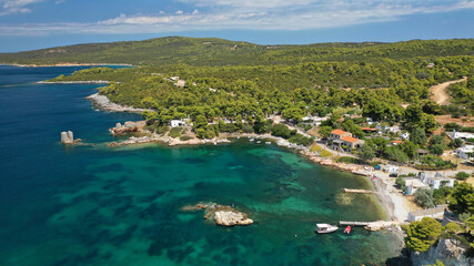 Fototapeta na wymiar Aerial drone photo of famous bay and small traditional village of Atsitsa covered in pine trees and natural sandy beaches, Skiros island, Sporades, Greece