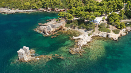 Obraz premium Aerial drone photo of famous bay and small traditional village of Atsitsa covered in pine trees and natural sandy beaches, Skiros island, Sporades, Greece