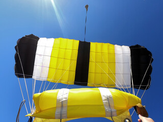 Yellow black and white parachute
