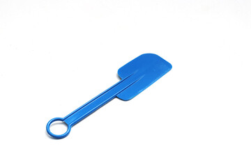 Blue plastic spatula isolated on white background