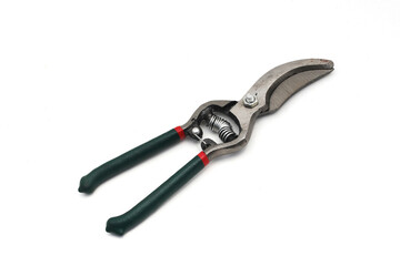 Pruning scissors (Pruning shears, Garden secateurs) with green grip isolated on white background