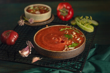 A bowl of Spanish traditional cold tomato and cucumber gazpacho soup