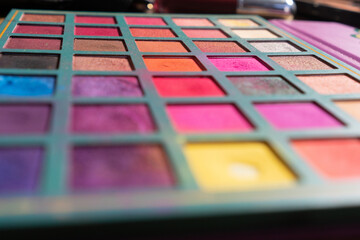 Case with different colors and shades of shadows, face makeup