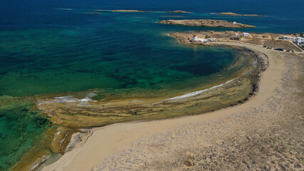 Aerial drone photo of beautiful round sandy bay and traditional windmill in Molos area next to famous church and islet of Agios Ermolaos, Skiros island, Sporades, Greece