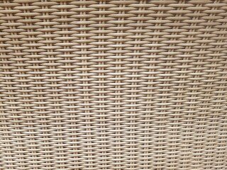 wicker furniture texture , beige wicker handmade texture with wavy ornaments. Background and texture.
