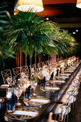 table setting for elegant dark wedding reception