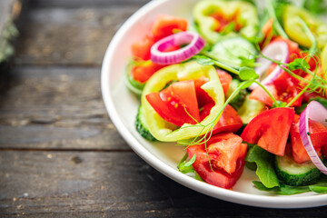 salad vegetables tomato, cucumber, pepper, onion, olive oil healthy food fresh portion veggie ready to eat meal snack on the table copy space food background rustic keto or paleo diet vegan