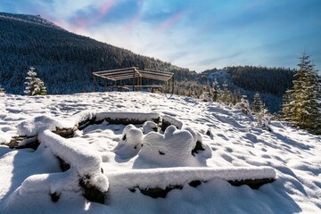 Buried snow-coveredsite for hiking in the mountains i bright cold sun