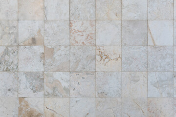 Checkerboard background of marble imitation tiles