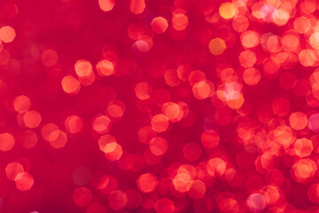 Red glowing sequins blurred background