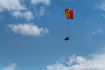 paragliding in the blue sky