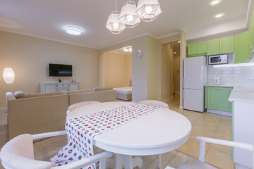 interior photography large studio room with green modern kitchen