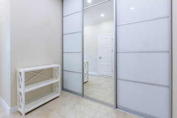 interior photo corridor entrance to the apartment with a large white closet