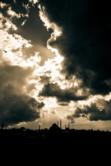 Fototapeta na wymiar Silhouette of the mosque with cloudy sky. Dramatic clouds