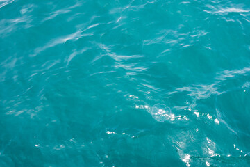 Turquoise wavy sea background. Sea texture.