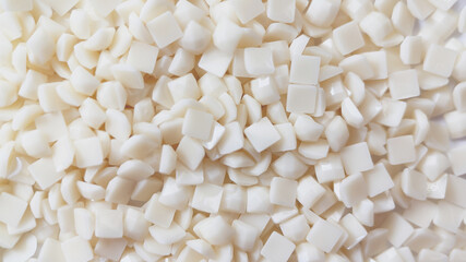 Close-up, white square diamonds for diamond embroidery. Hobbies and DIY, materials for creating diamond embroidery