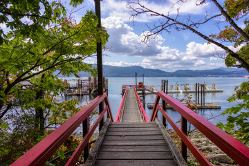 Wooden Pier on the Pacific Ocean West Coast. Sunny Summer Day. Vesuvius Bay, Salt Spring Island,...