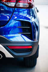 Obraz na płótnie Canvas Detail of a luxury Modern blue car headlights. Led car headlights.