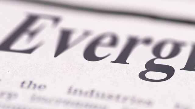Footage of Evergrande written newspaper close up shot to the text.