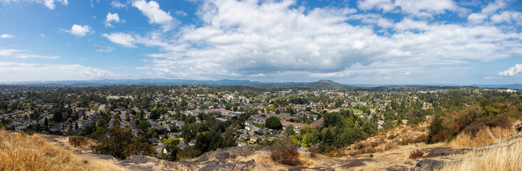 Scenic View of Modern City during a sunny summer day. Mt Tolmie Park, Victoria, Vancouver Island,...