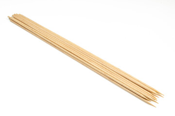 Collection of wooden skewer sticks isolated on white background