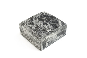 Black wet and foamy soap bar isolated on white background. 