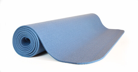 Blue fitness mat isolated on white background. Rolled Yoga rubbery item
