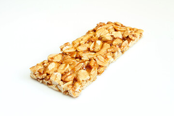Thin protein bar made of peanuts isolated on white background.