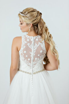 blonde caucasian bride on white dress