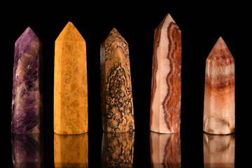 Beautiful view of a variety of colorful crystals on a pitch black background