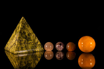 Beautiful view of a variety of colorful crystals on a pitch black background