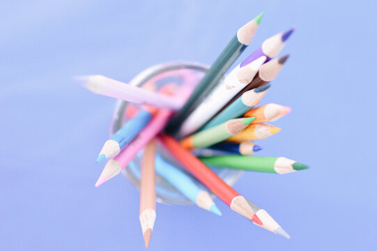 Top View Of A Glass Jar With Colored Wood Pencils