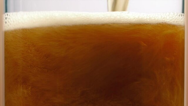 Beer Fills Up Glass Closeup