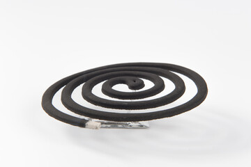 Burning mosquito coil isolated on white background