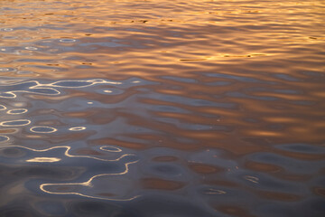 Beautiful sunset reflecting on the water while sailing at Narragansett Bay, Rhode Island USA