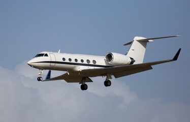 Light private jet comes in for a landing. High quality photo