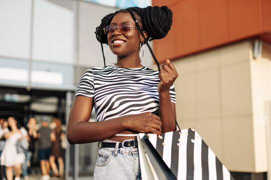 African American Woman Wearing Glasses, With Shopping Bags, Woman With Bags Coming Out Of The Store