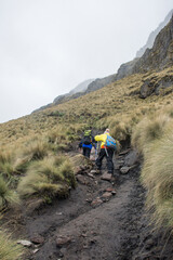 People climbing towards the mountain