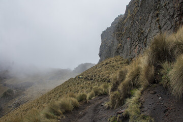Path under the mountain with mist