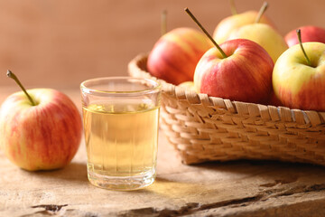 Fresh red apple fruit and juice on wooden background