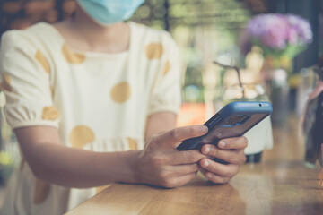 Woman use smartphone choosing social media interactions on mobile phone, concept, internet digital marketing,soft focus