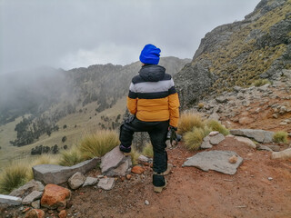 Photographer capturing mountain scenery